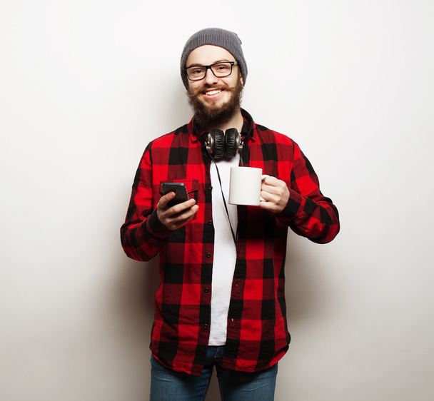 young bearded man with mobile phone - Zdjęcie, obraz