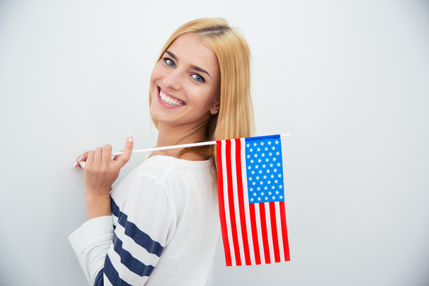 Girl holding USA flag  - Fotó, kép