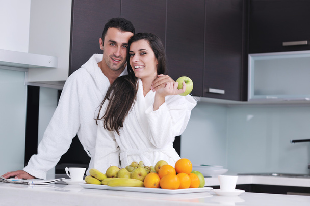 Young couple have fun in modern kitchen - Φωτογραφία, εικόνα