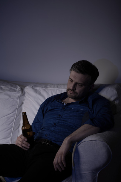 Man falling asleep with bottle - Photo, image