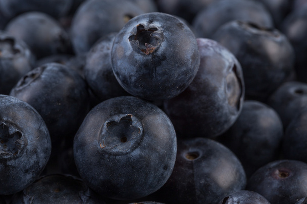 Blueberries on stone plate background - Foto, Imagen