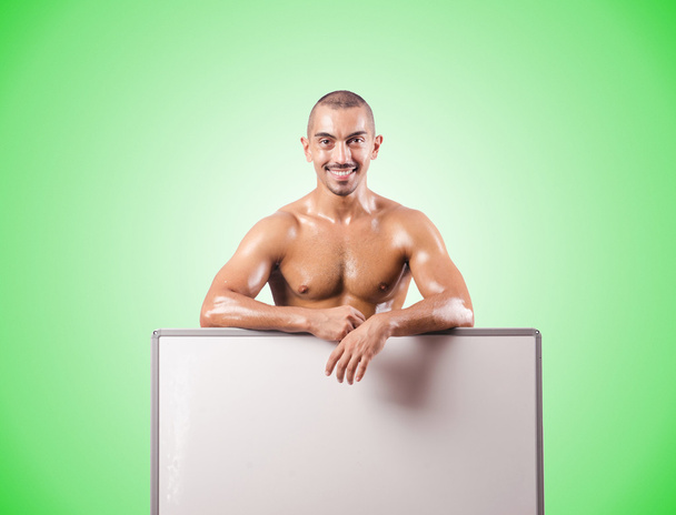Half naked man with blank board - Photo, Image