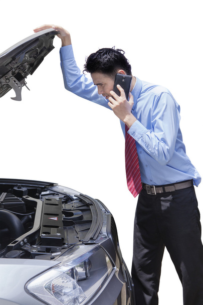 Worker with broken car calling mechanic - 写真・画像