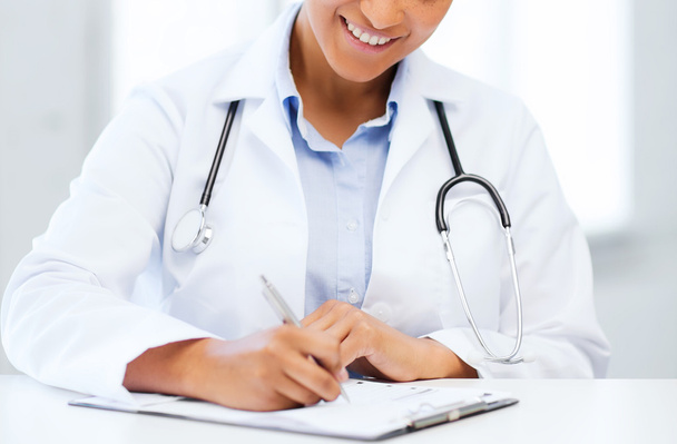 female doctor writing prescription - 写真・画像
