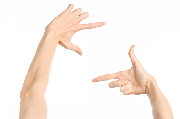 Sujet des gestes : gestes de la main humaine montrant vue à la première personne isolée sur fond blanc en studio
 - Photo, image
