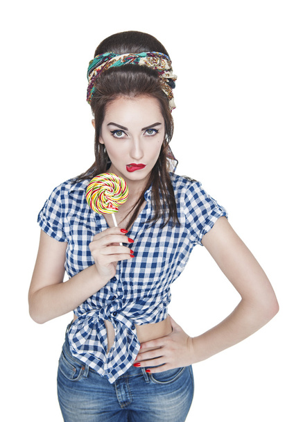 Young beautiful woman in retro pin up style with lollipop isolat - Foto, afbeelding