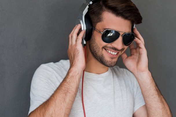 man in headphones listening to  music - Fotó, kép