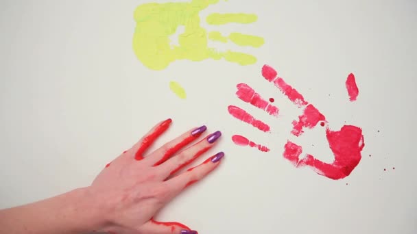 Human Hands Leave Imprints In The Paint On The Wall. - Video