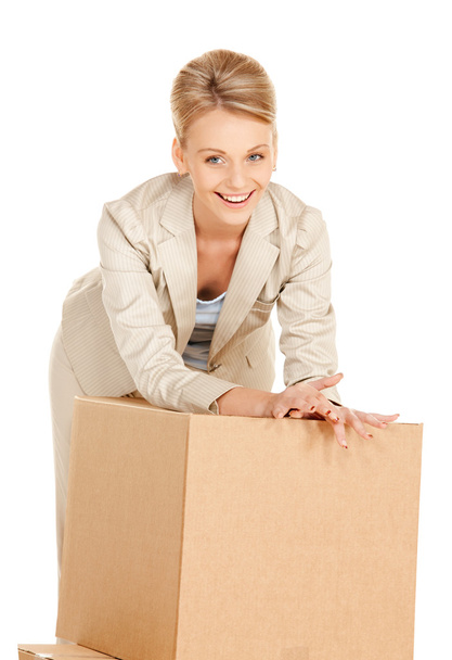 Attractive businesswoman with big boxes - Foto, afbeelding