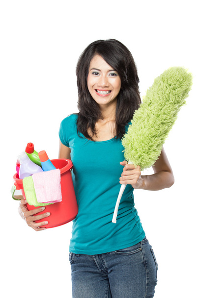 woman holding a basket full of cleaning products ready to do som - Fotografie, Obrázek