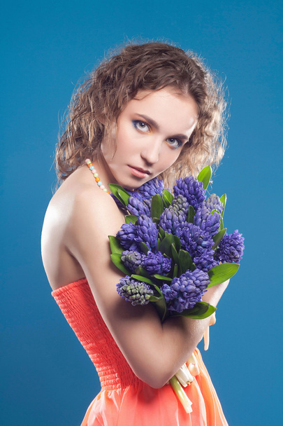 beautiful young woman with flowers - Fotó, kép