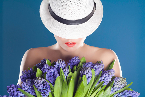beautiful woman in hat with flowers - Photo, Image