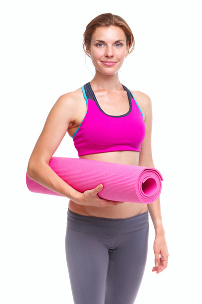Portait of young woman with yoga mat. - Φωτογραφία, εικόνα