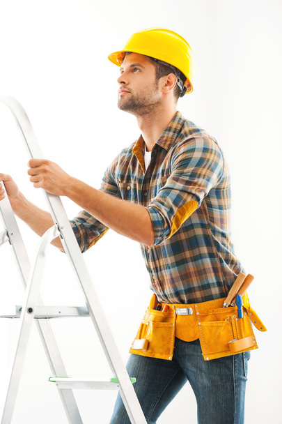 crafts person climbing up ladder - Photo, image