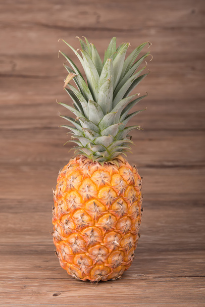 Pineapple on wooden grunge background - Foto, immagini