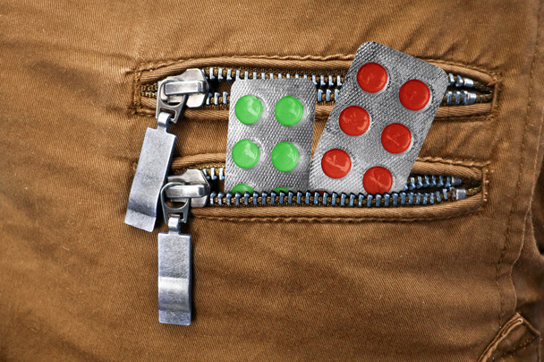 Pills in the pocket of jeans - Photo, Image