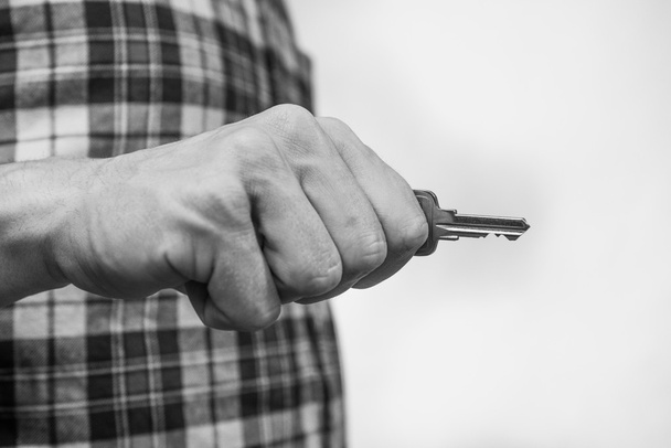 Hand holding a key - Фото, зображення