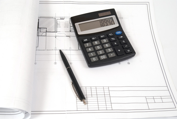 Calculator and pen on blueprint - Photo, Image