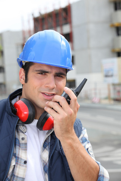 Construction worker with radio - 写真・画像