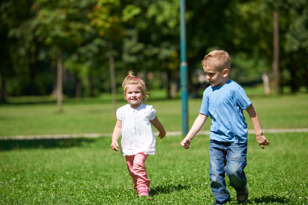 Boy and girl running in park - Foto, Imagem