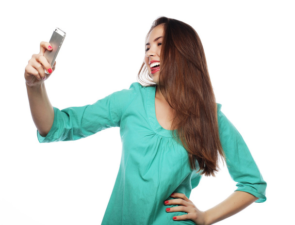 Pretty teen girl taking selfies - Fotó, kép