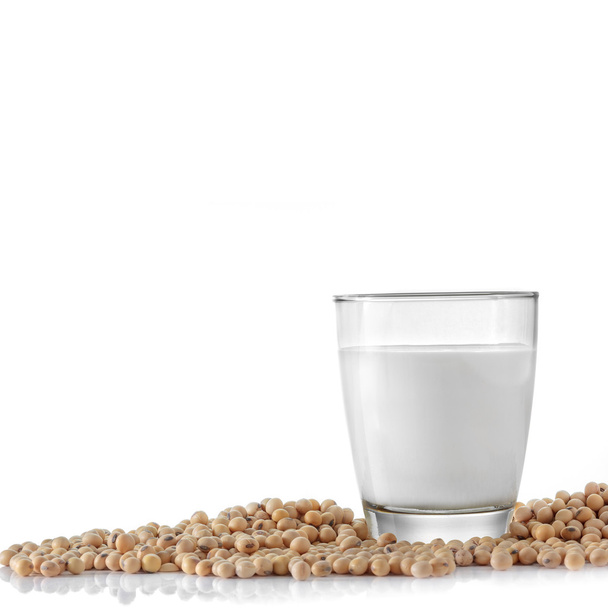 Glass of soymilk and soybean on white background. - Foto, Imagem