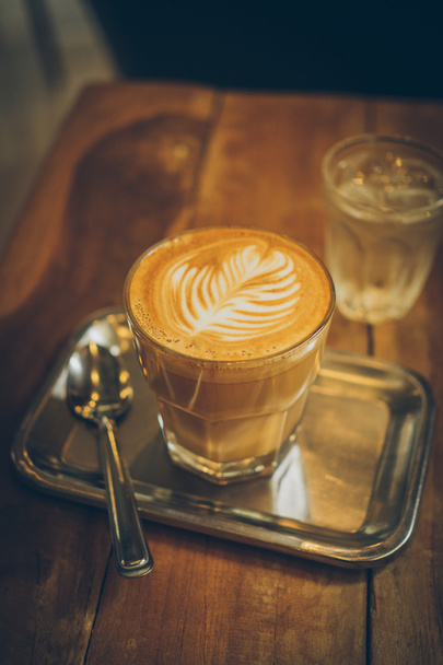 cup of coffee latte on the wood texture  - Fotó, kép