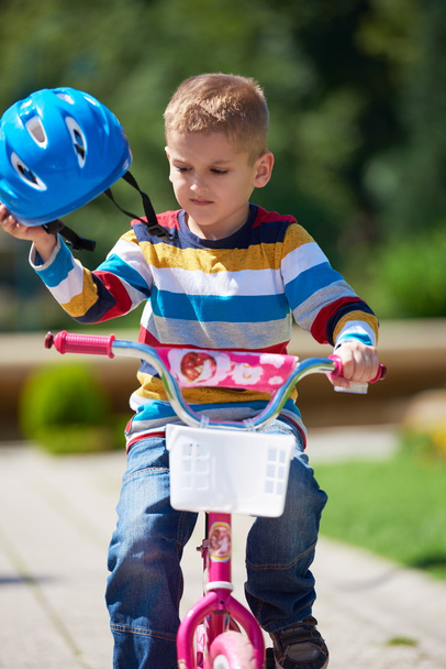happy boy learning to ride his first bike - 写真・画像