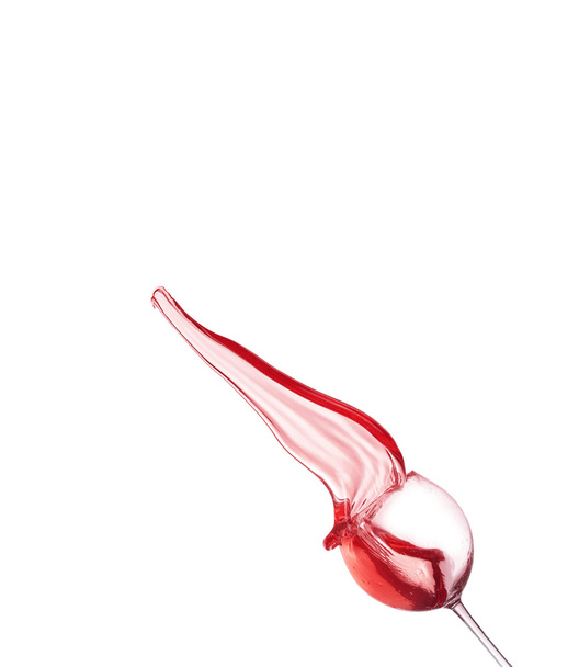 Red wine splashing from glass, isolated on white background - Foto, imagen