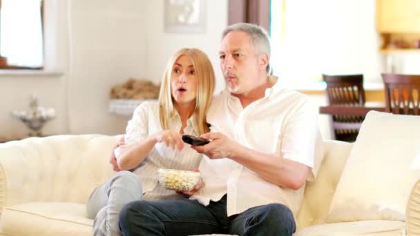 couple watching tv together - Felvétel, videó