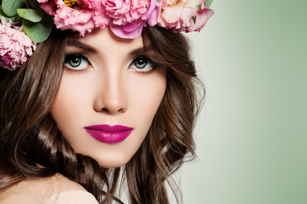 Beautiful Girl with Flowers. Face Closeup. Makeup and Hairstyle - Photo, Image
