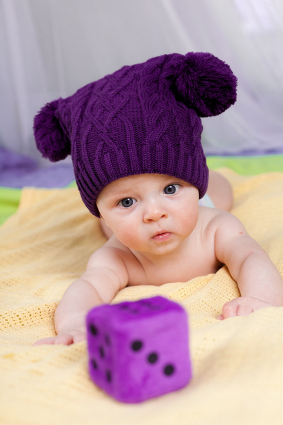 Cute little boy looking to cube - Photo, Image