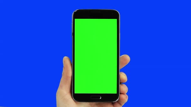 Preto telefone inteligente chroma chave azul e verde com mão real
 - Filmagem, Vídeo