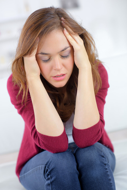 Woman suffering from a headache - Фото, изображение