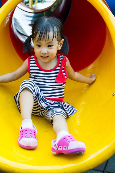 Asian kid sliding on Playground - Valokuva, kuva