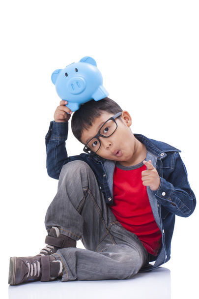 little boy with piggy bank - Foto, immagini