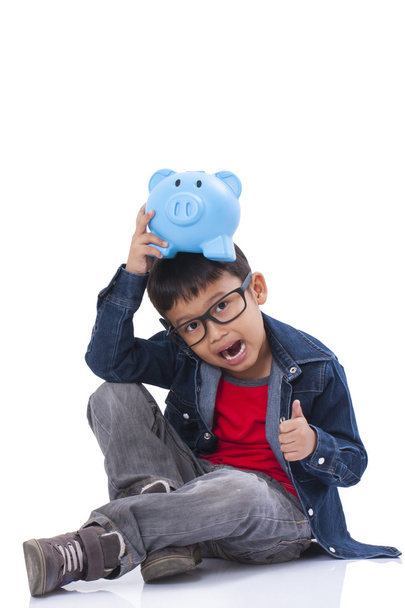 little boy with piggy bank - Fotoğraf, Görsel