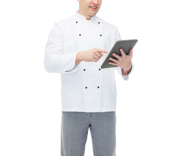 close up of happy male chef cook holding tablet pc - Fotó, kép