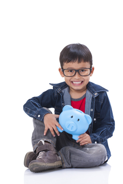 little boy with piggy bank - Foto, imagen