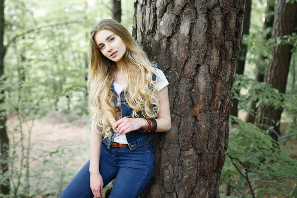 Young hipster girl in the forest hike - 写真・画像