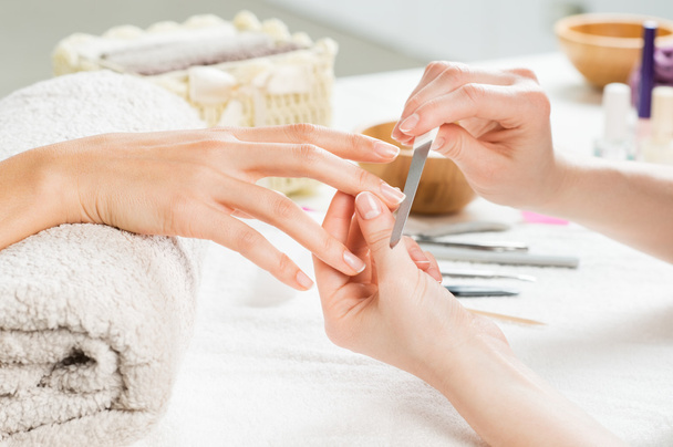 Manicure treatment at nail salon - Φωτογραφία, εικόνα