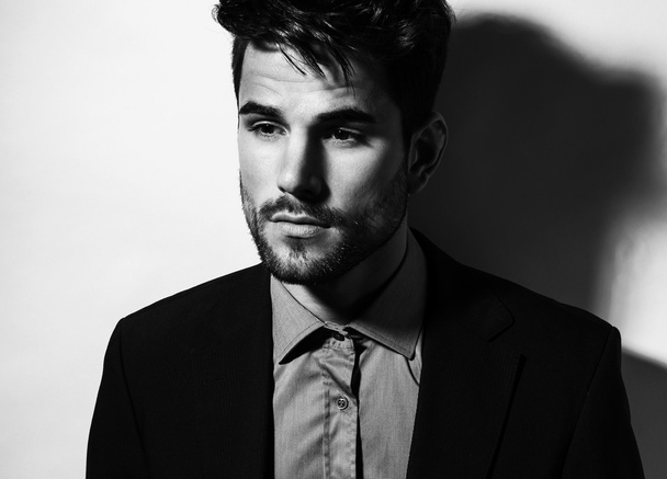 handsome young man in suit on grey background. Business man - Foto, Imagem