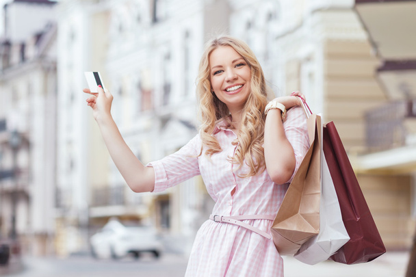 Girl with packages after shopping - Foto, Imagem