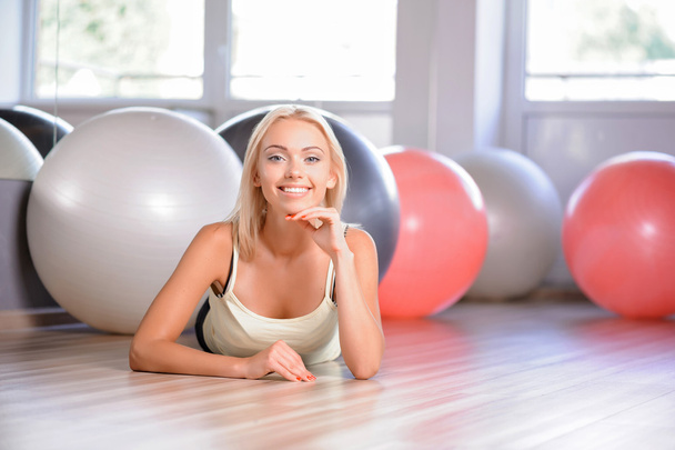Blond girl with a fitness balls - Fotoğraf, Görsel