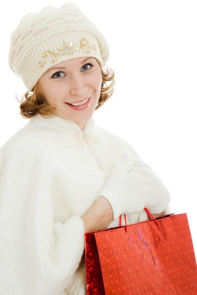 Woman with Christmas presents on a white background. - Valokuva, kuva