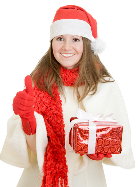 Happy Christmas woman points a finger upward on a white background. - Foto, Imagen