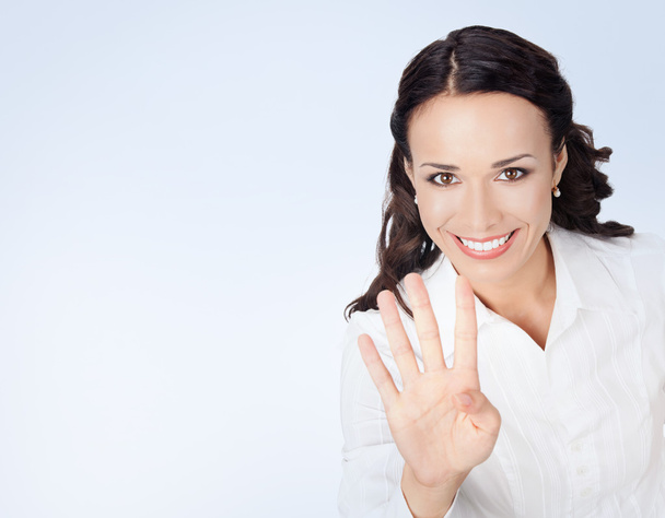 Businesswoman showing four fingers - Fotografie, Obrázek