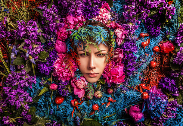 Fairy tale girl portrait surrounded with natural plants and flowers. Art image in bright fantasy stylization. - Zdjęcie, obraz