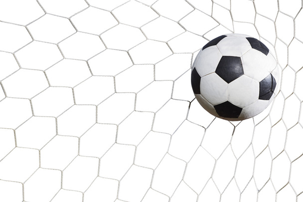 白い背景の上のゴールにサッカー ボール - 写真・画像