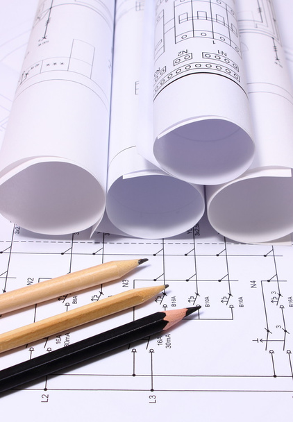 Rolls of electrical diagrams and pencils - Photo, Image